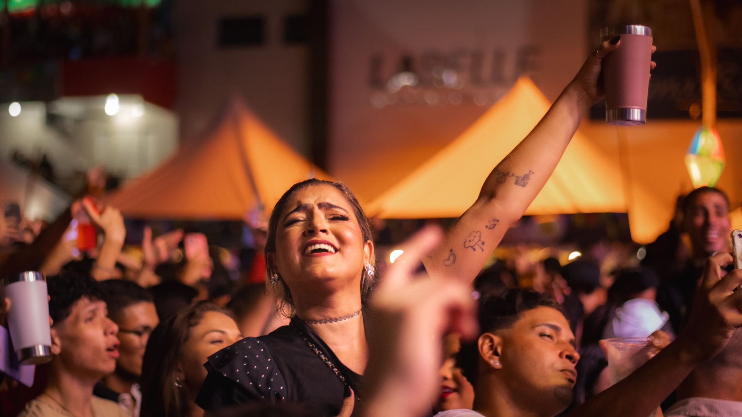 Energetic crowd enjoying a festive night event in Piranhas, Brazil.